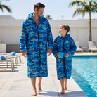 swim parka with sharks pattern on man and boy