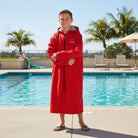 Childs red swim parka keeps car seats dry